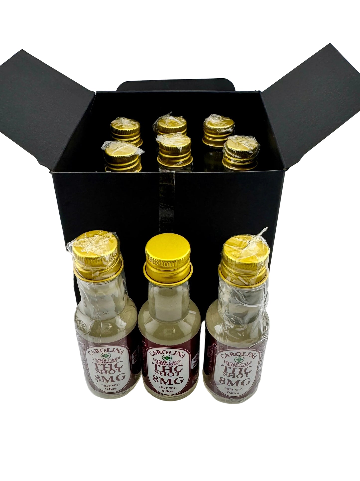 Three small bottles with gold caps and labels in a black box on a white background