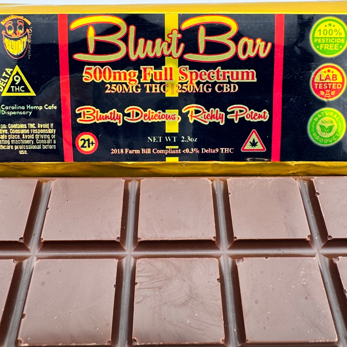 Chocolate bar with 'Blunt Bar' packaging featuring THC and CBD information.