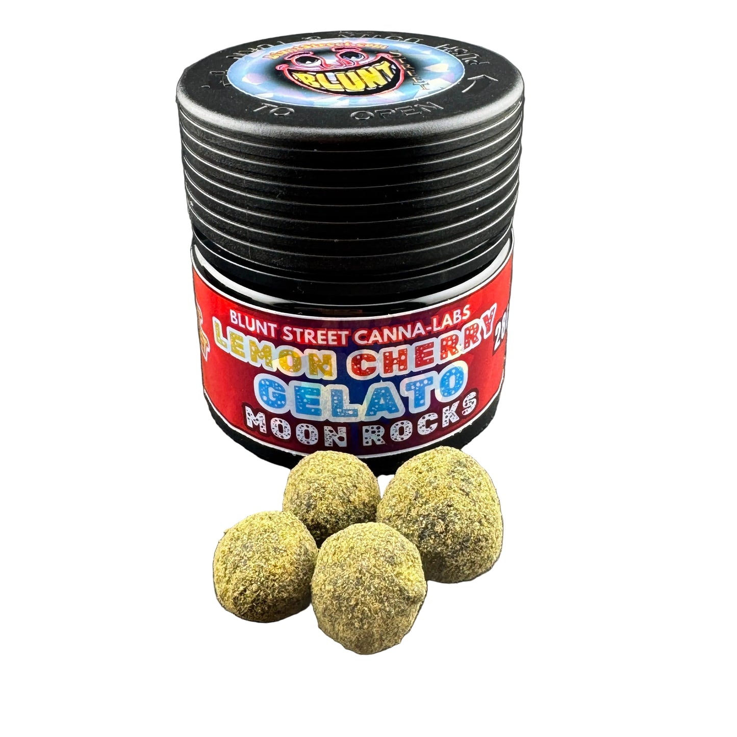 A black metal grinder jar labeled 'BLUNT STREET CANNA-LABS LEMON CHERRY GELATO MOON ROCKS' with four green-brown gelato-style buds placed in front on a dark gray surface.