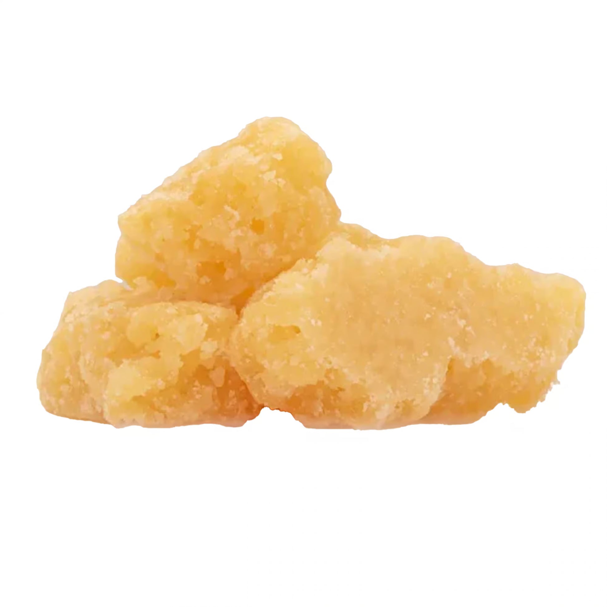 Three pieces of yellow thca sugar crumble on a white background