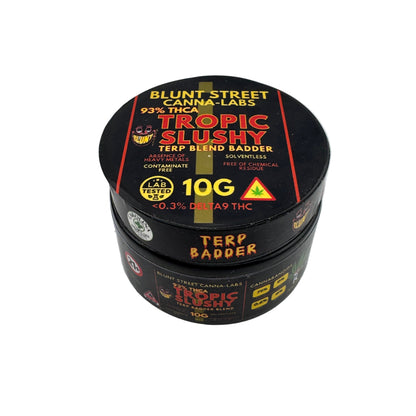 Black container labeled 'Tropic Slushy' with branding on a white background