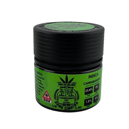 Green and black container with cannabis product label on a white background