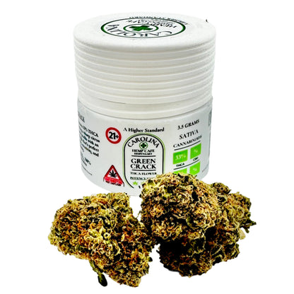 Jar of Carolina Hemp Cafe Green Crack with cannabis buds on a white background