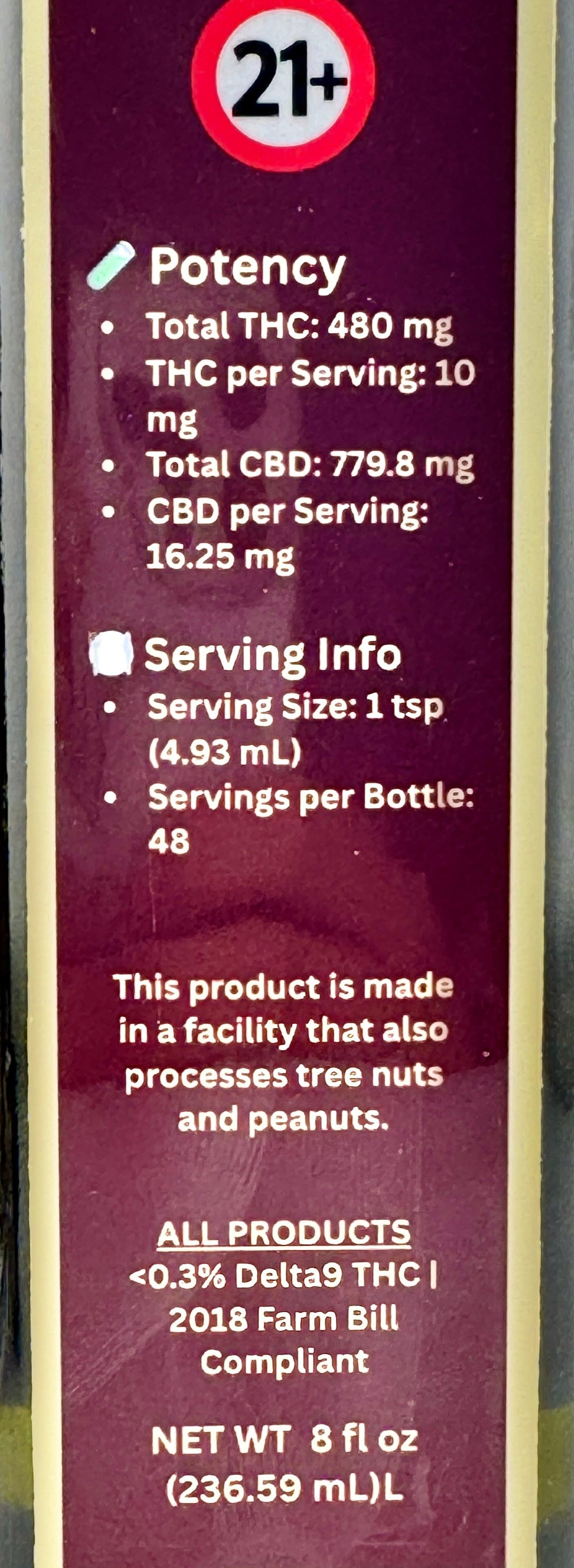 Product label with potency and serving information on a gray background