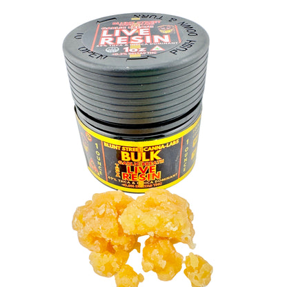 Jar of live resin with yellow substance on a white background