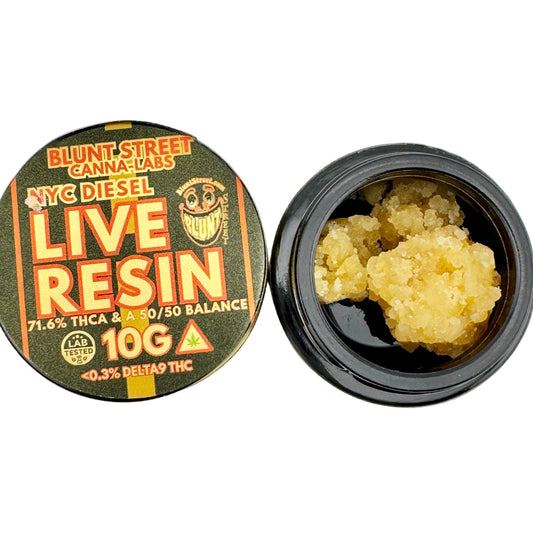 Open container of live resin with visible cannabis material on a gray background