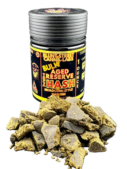Jar of Blunt Street Canna Labs hash with hashish outside on a gray background