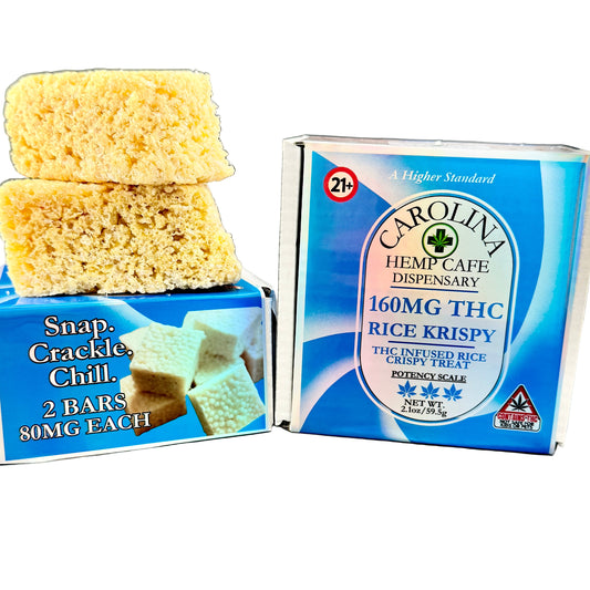 Two boxes of THC-infused rice krispy treats with visible branding on a gray surface.