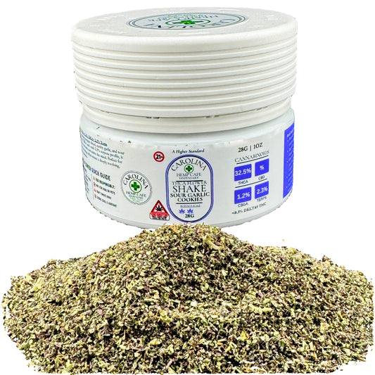 Jar of dried herbs with a label on a dark surface