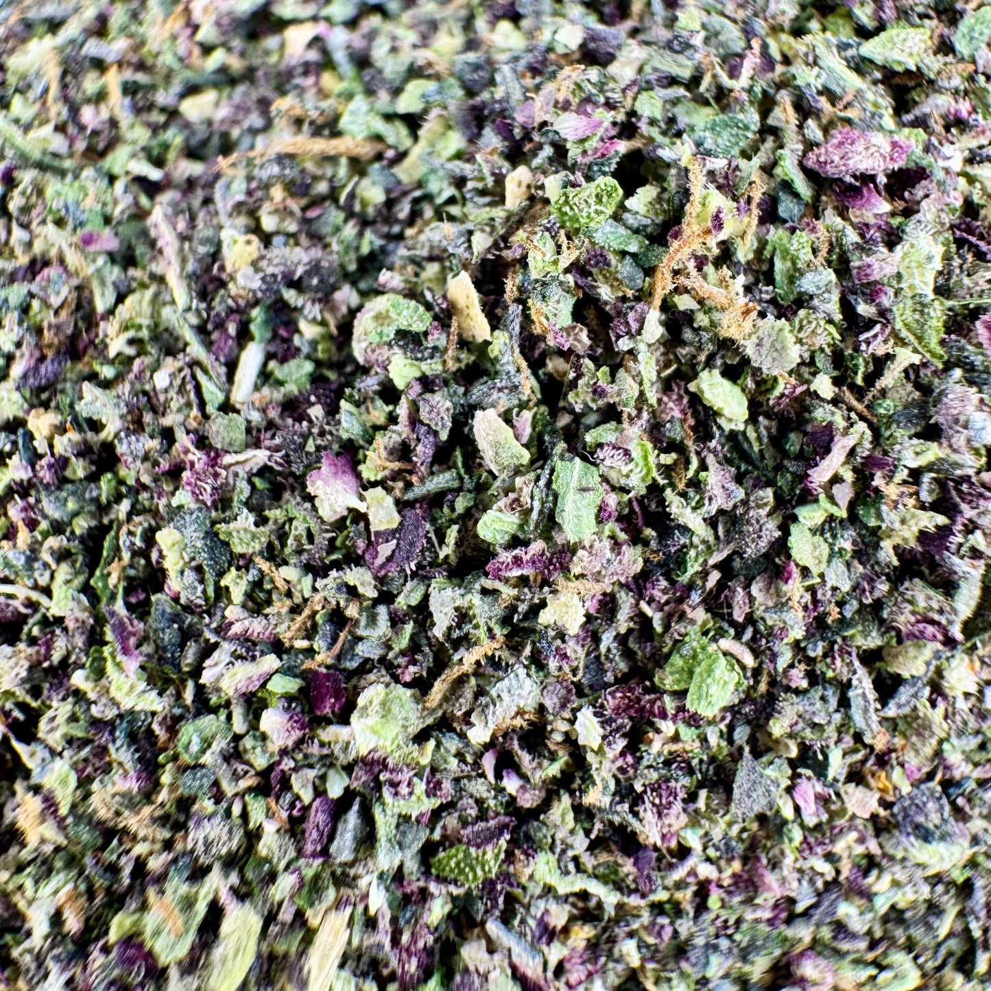 Close-up of dried green and purple herbs