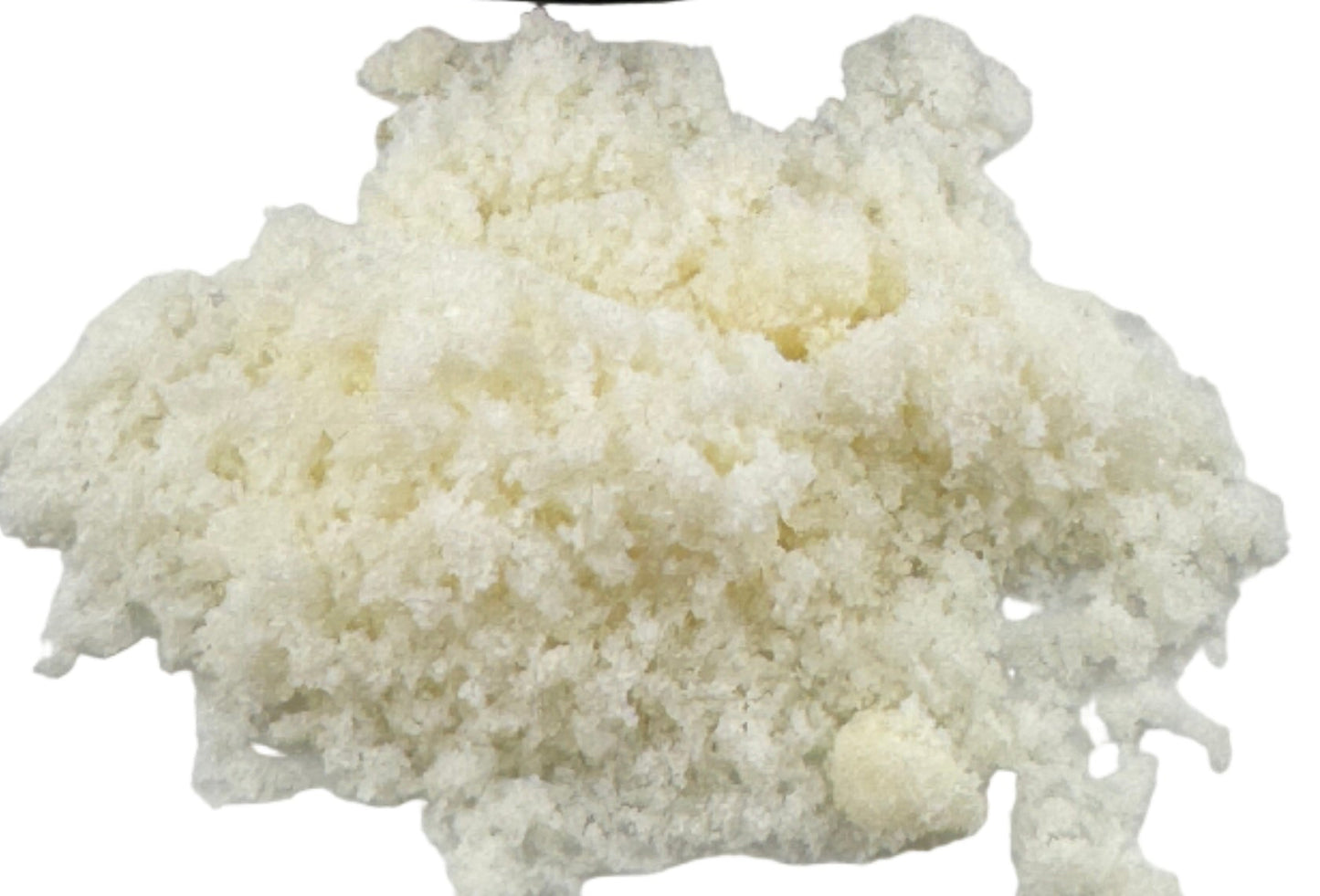 Cannabis concentrate container with white substance on a light background