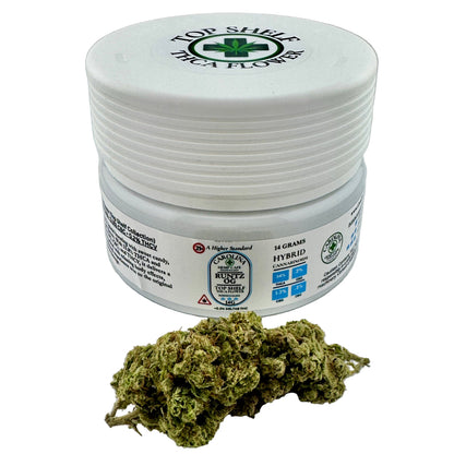 Jar of cannabis buds with visible branding on a gray background