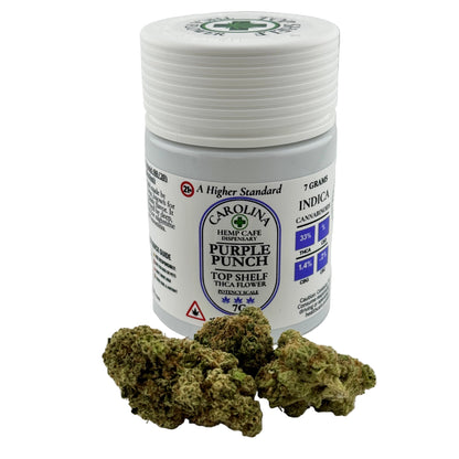 Jar of Carolina Hemp Cafe Purple Punch with cannabis buds on a white background