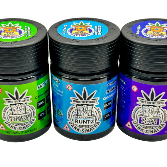 Three jars of cannabis products with colorful labels on a white background