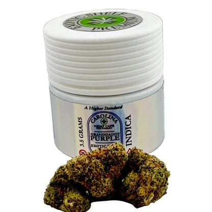 Jar of Carolina Hemp Cafe Grandaddy Purple Indica cannabis with two buds on a light gray background
