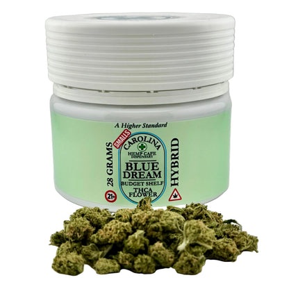 Jar of Blue Dream hybrid cannabis flower with visible branding on a gray background