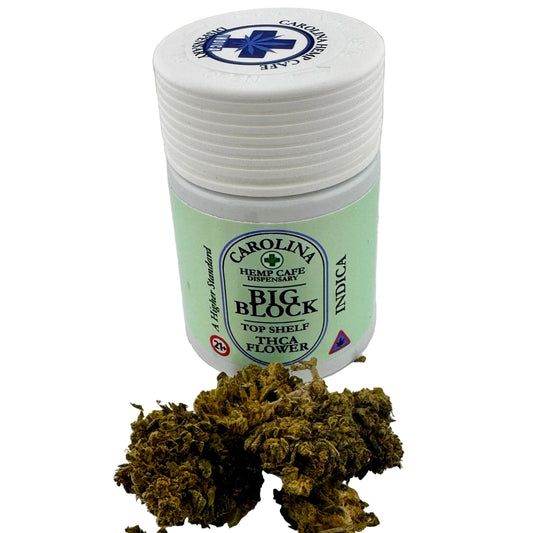 Jar of Carolina Hemp Cafe Big Block Indica with cannabis buds on a white background