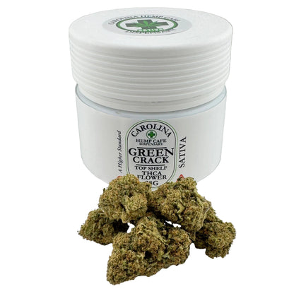 Jar of Carolina Hemp Cafe Green Crack with cannabis buds on a white background