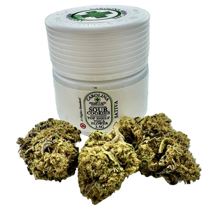 White container labeled 'Carolina High Cafe' with cannabis buds on a gray background