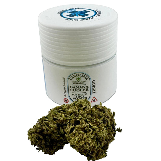 White container with marijuana buds on a white background