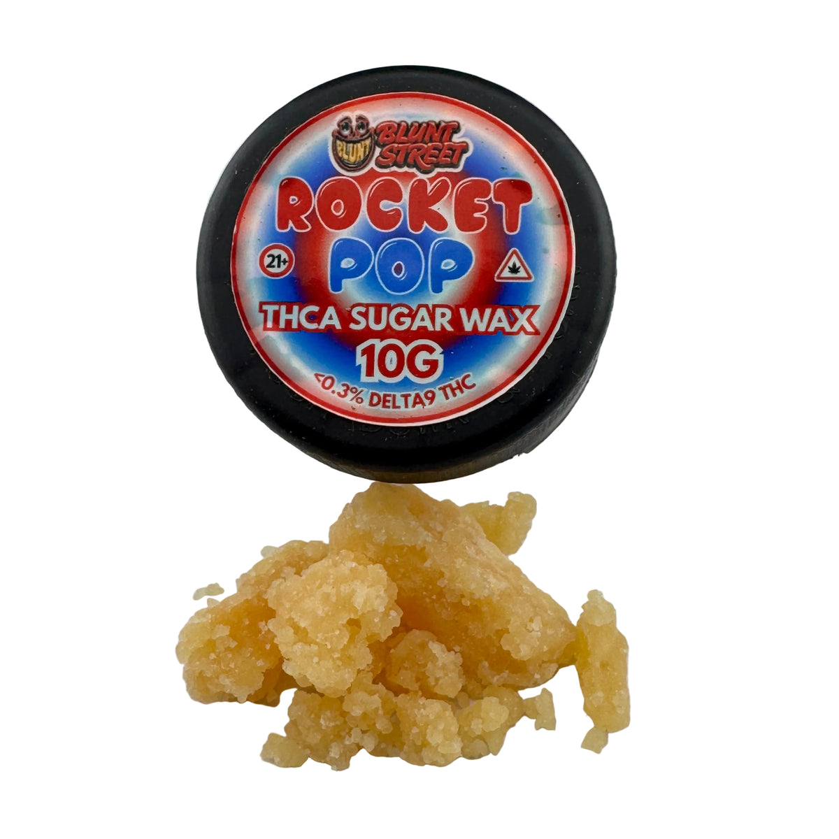 A 10g tin of Quik Kit Rocket Pop Thca Sugar Wax sits on a white surface with a small pile of the translucent yellow wax crystals in front of it.