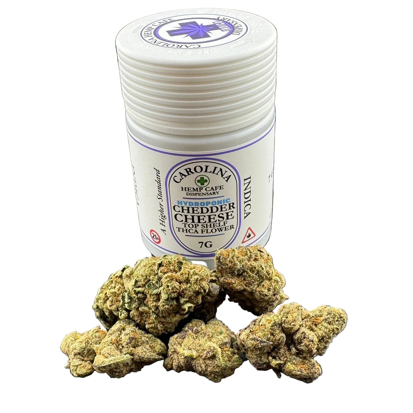 A white plastic jar labeled Carolina Hydroponic Cheddar Cheese Top Shelf Indica hemp cafe dispensary, shown with several dried green-brown flower buds in front on a dark gray background.