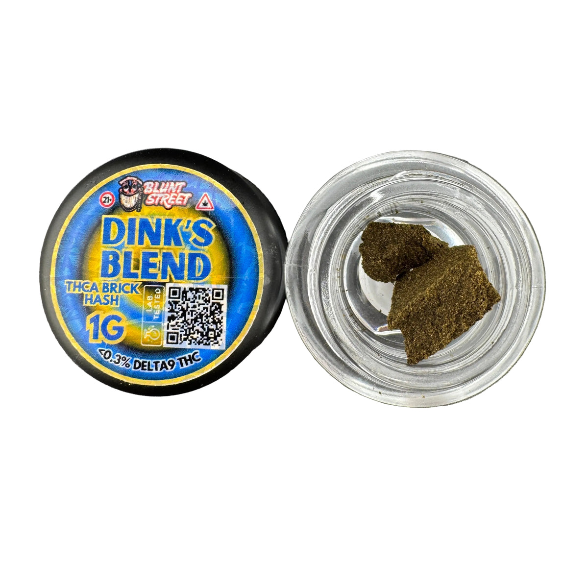 A top-down view of a 'Blunt Street' Dink's Blend THC A Brick Hash product. The left side shows the black plastic container lid with a blue and yellow label, and the right side shows an open clear glass jar containing two brownish-green textured hash crystals on a gray textured surface.
