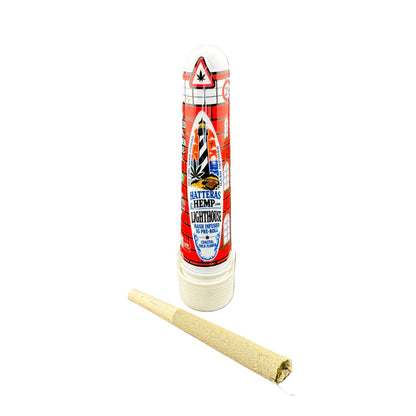 A tube of Mattress Hemp Lightboks next to a rolled beige hemp paper cone, shown on a plain white background.