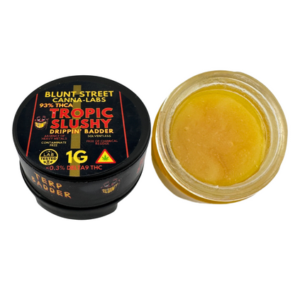 Jar of Blunt Street Tropic Slushy Terp Badder with black lid on a white background