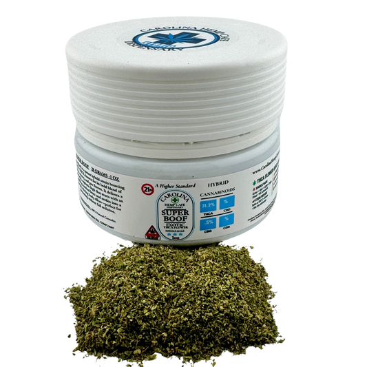 Jar of dried cannabis with a white lid on a white background